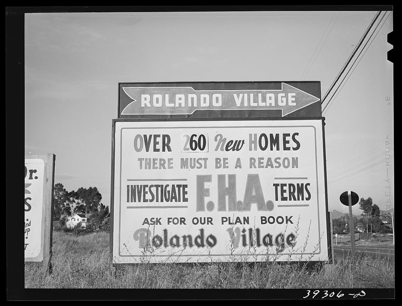 Photograph of a sign advertising loans from the Federal Housing Administration (FHA)