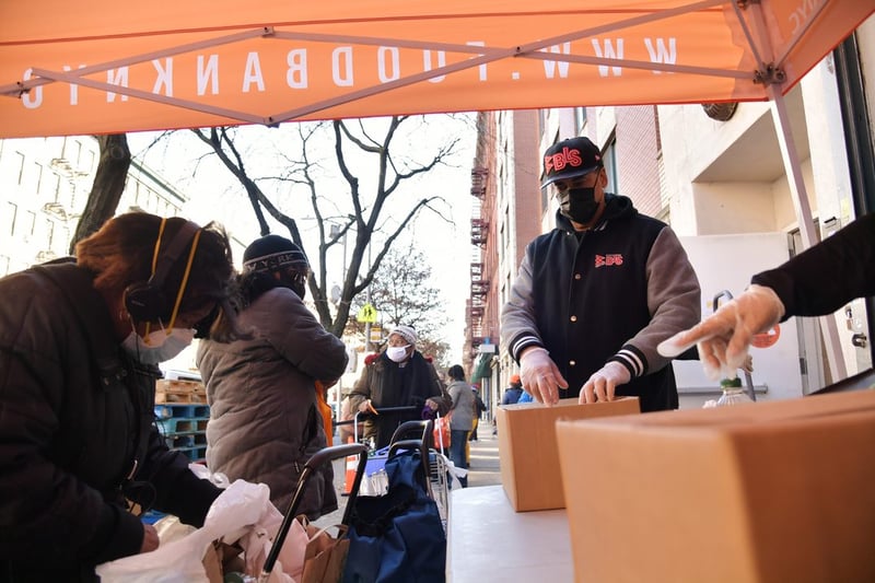 Food Bank For New York City volunteers distributing meals